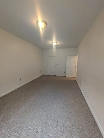 a bathroom with a double vanity sink mirror and shower