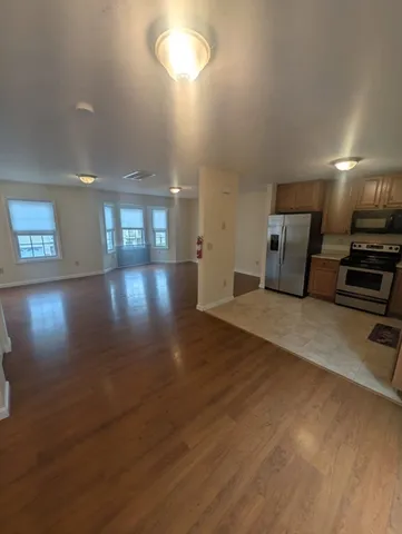 a view of a room with lots of wooden furniture