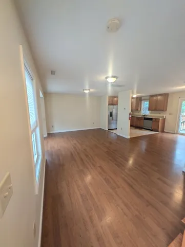 a view of a kitchen with a sink and a window