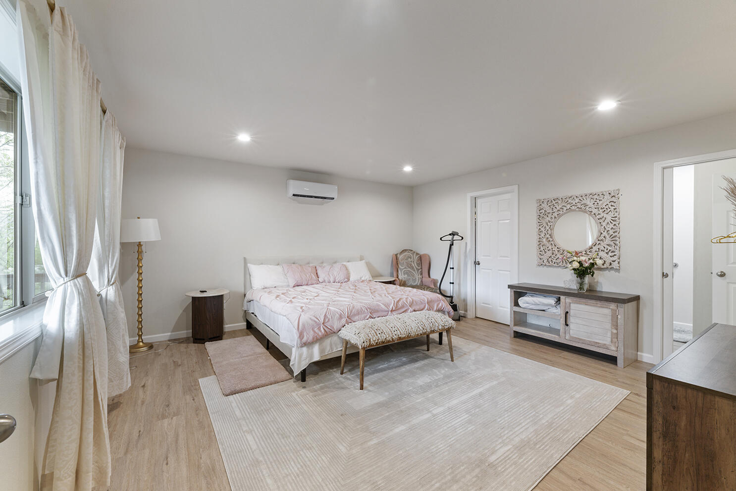457 Elm Street Phoenix, OR 97535 - Photo 17 of 27 a spacious bedroom with a bed and a dresser