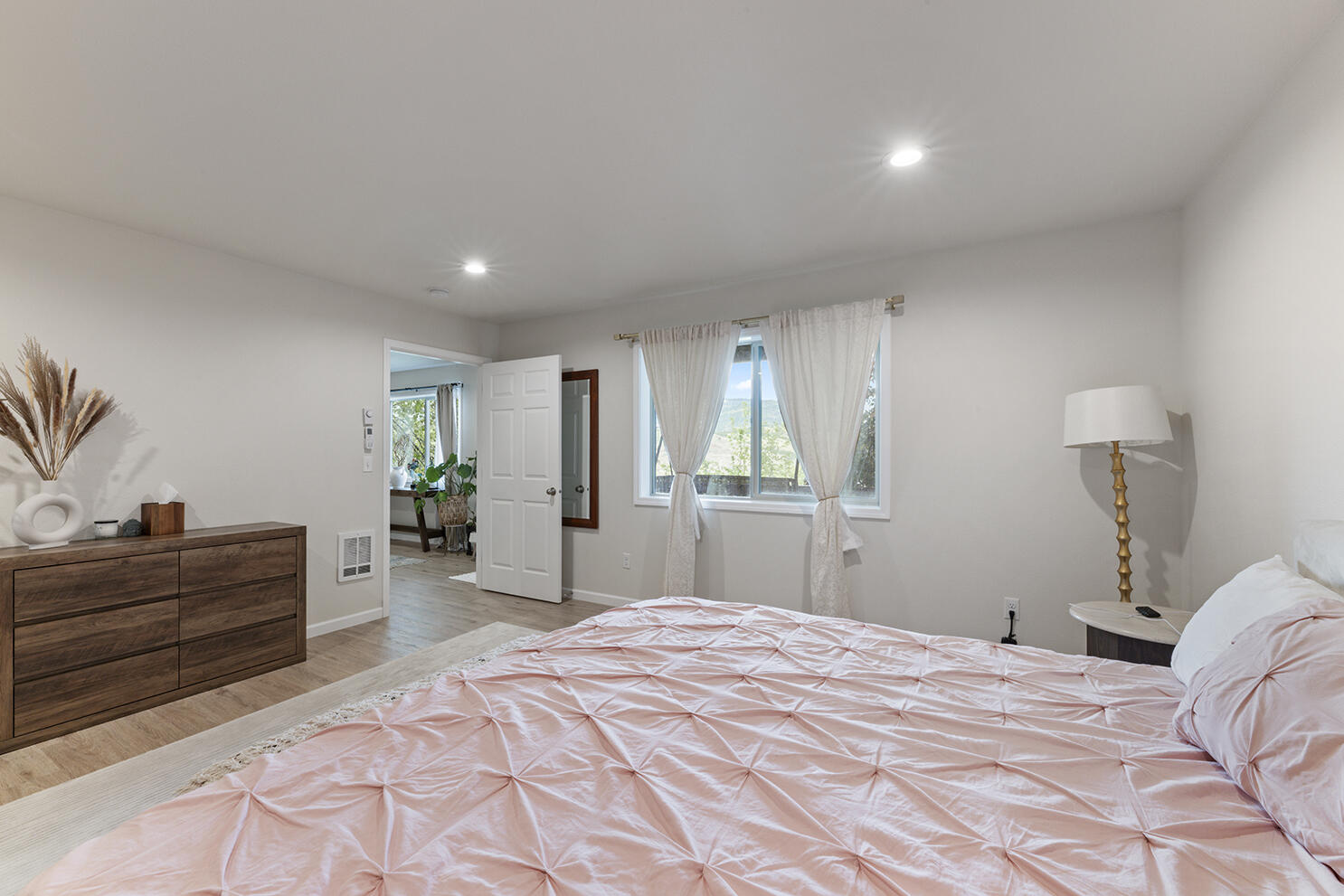 457 Elm Street Phoenix, OR 97535 - Photo 18 of 27 a bedroom with a bed and a dresser