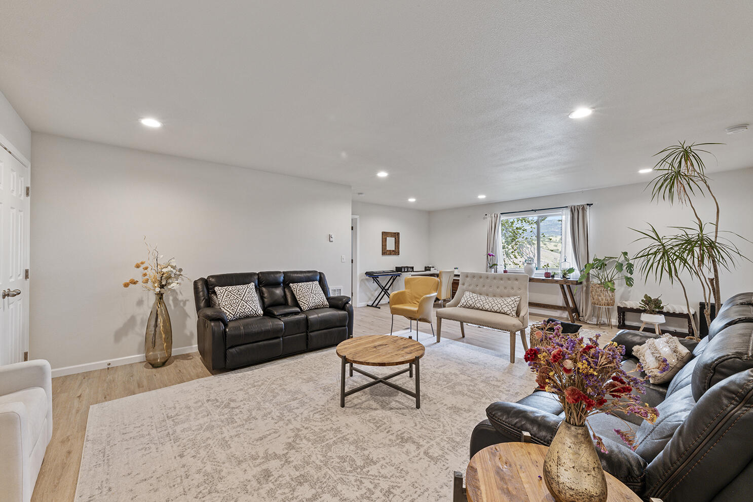 457 Elm Street Phoenix, OR 97535 - Photo 19 of 27 a living room with furniture and a large window