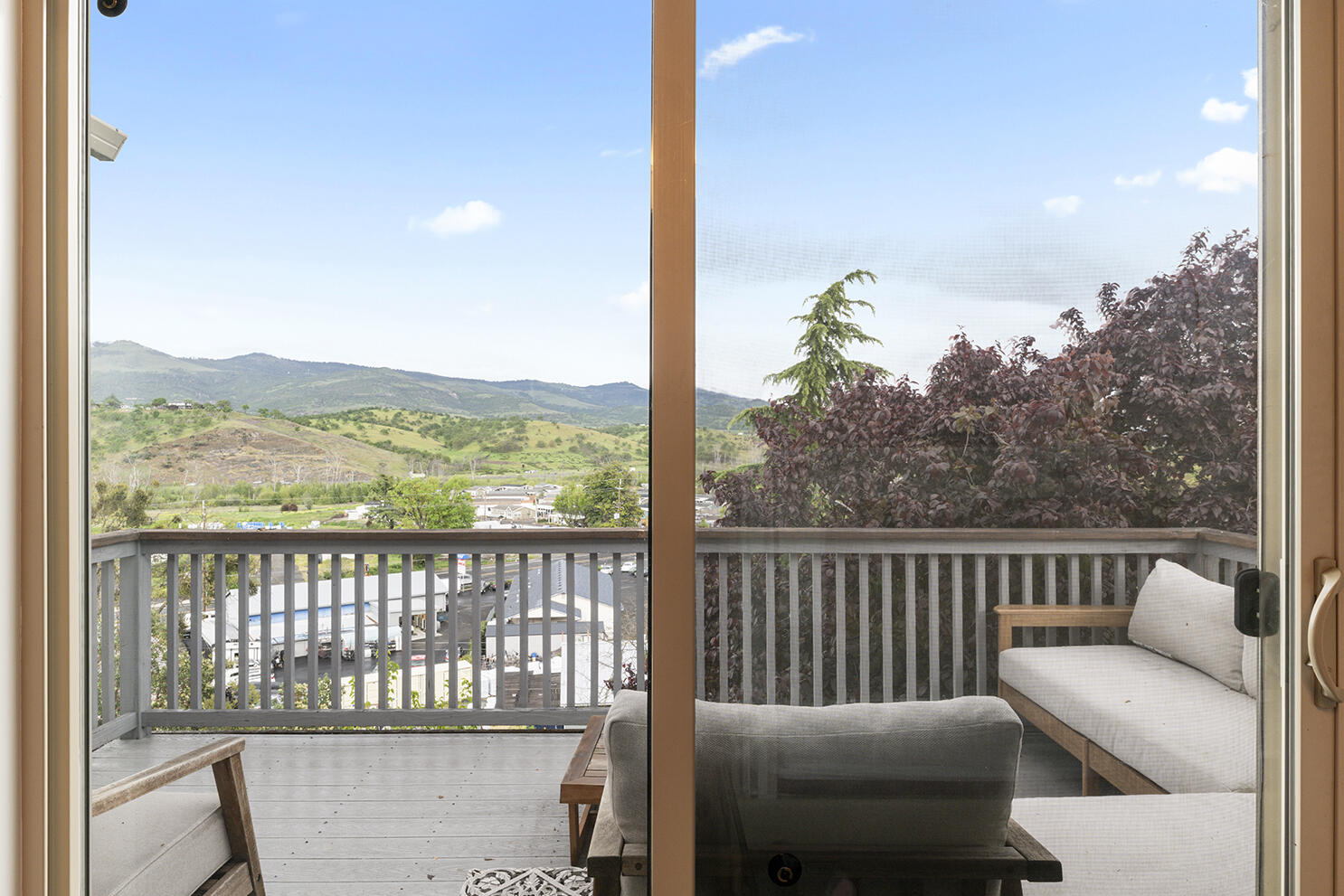 457 Elm Street Phoenix, OR 97535 - Photo 2 of 27 a view of a chair and tables in the balcony