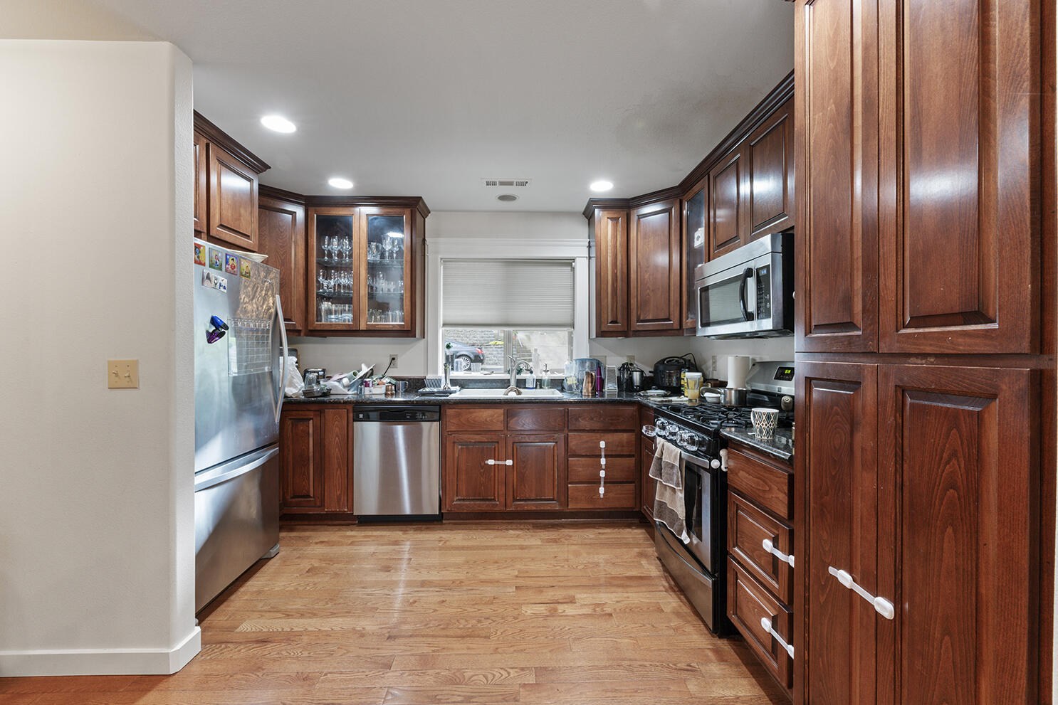 457 Elm Street Phoenix, OR 97535 - Photo 6 of 27 a large kitchen with stainless steel appliances granite countertop a stove a sink dishwasher and a refrigerator