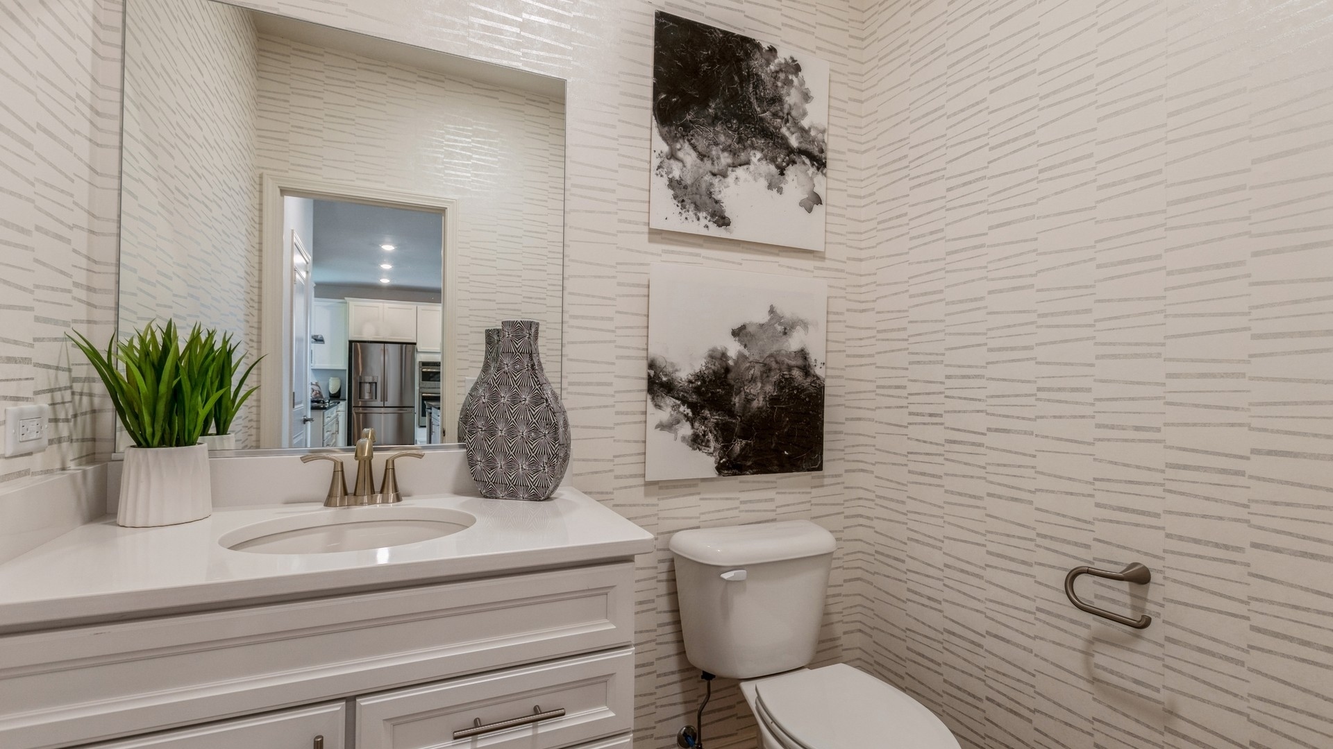 16155 Lake View Road Plainfield, IL 60586 - Photo 6 of 17 a bathroom with a toilet a sink and mirror