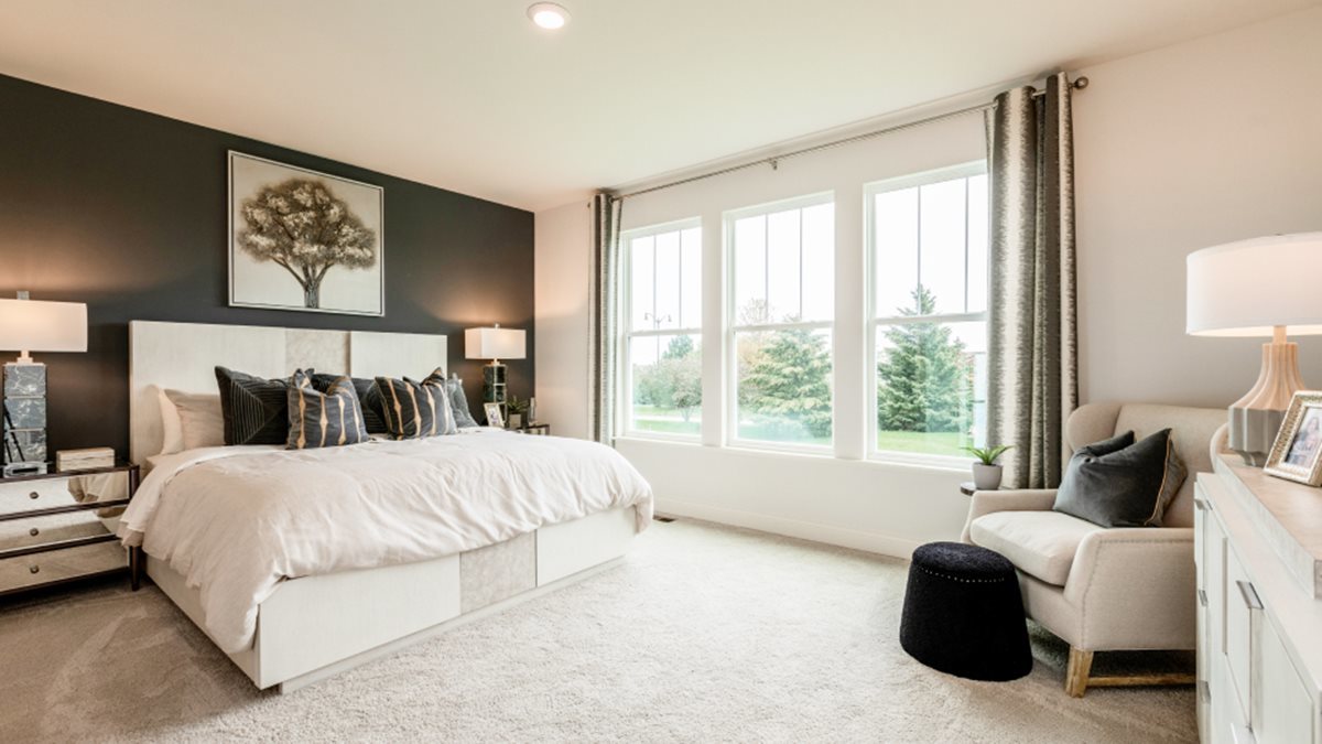 16155 Lake View Road Plainfield, IL 60586 - Photo 9 of 17 a bedroom with a bed and a large window