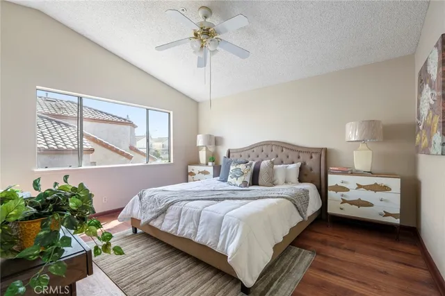 a bedroom with bed and a window