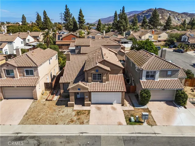an aerial view of a house with a garden