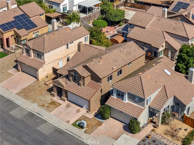 an aerial view of a house with a garden