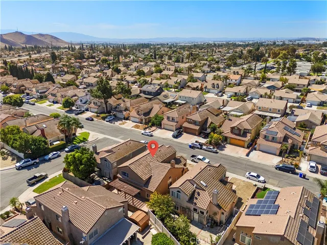 an aerial view of residential houses with outdoor space