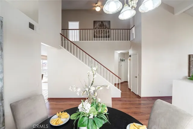 a view of entryway livingroom and hall with wooden floor