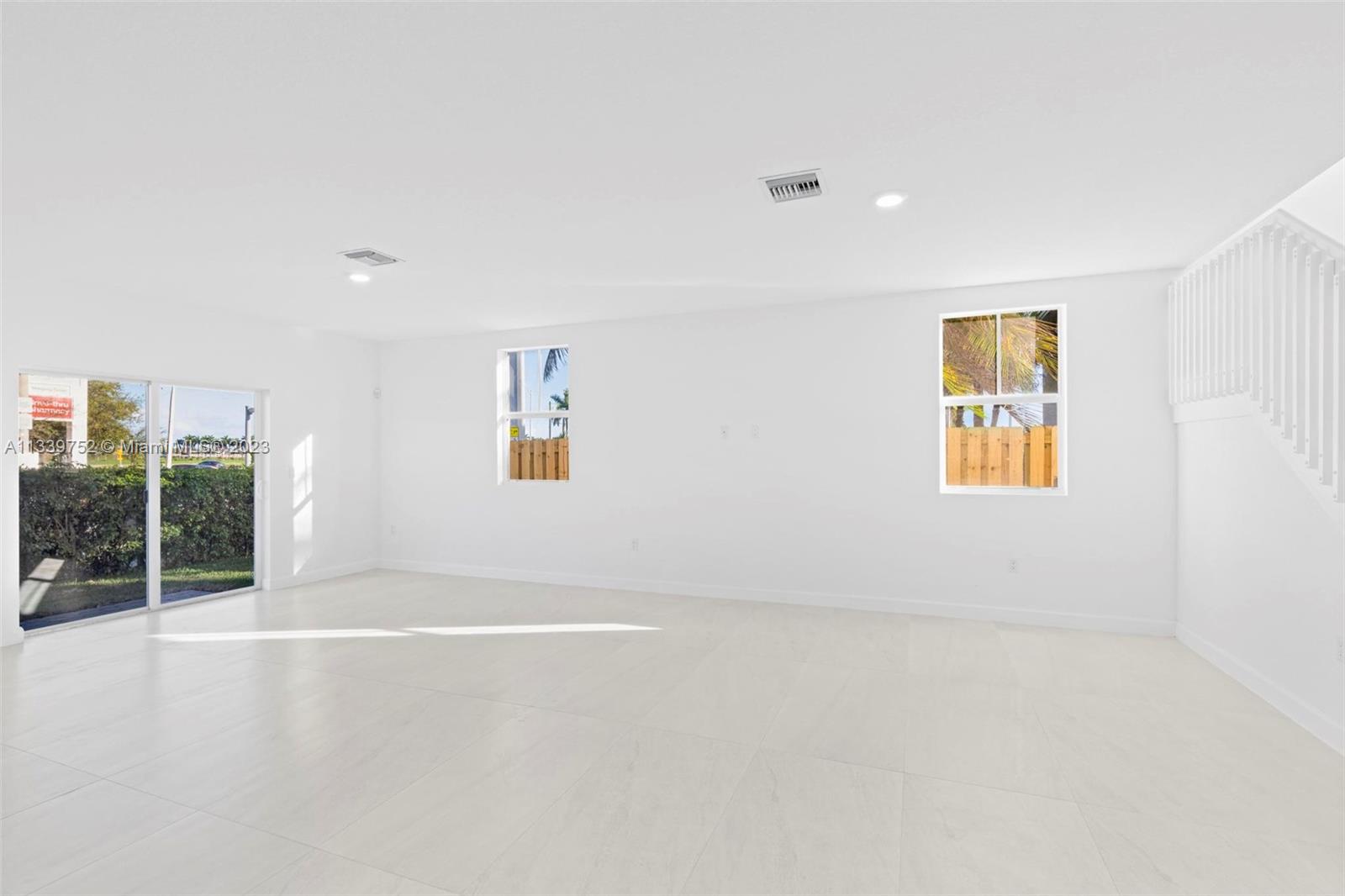 24721 Southwest 112th Court Homestead, FL 33032 - Photo 11 of 40 an empty room with windows