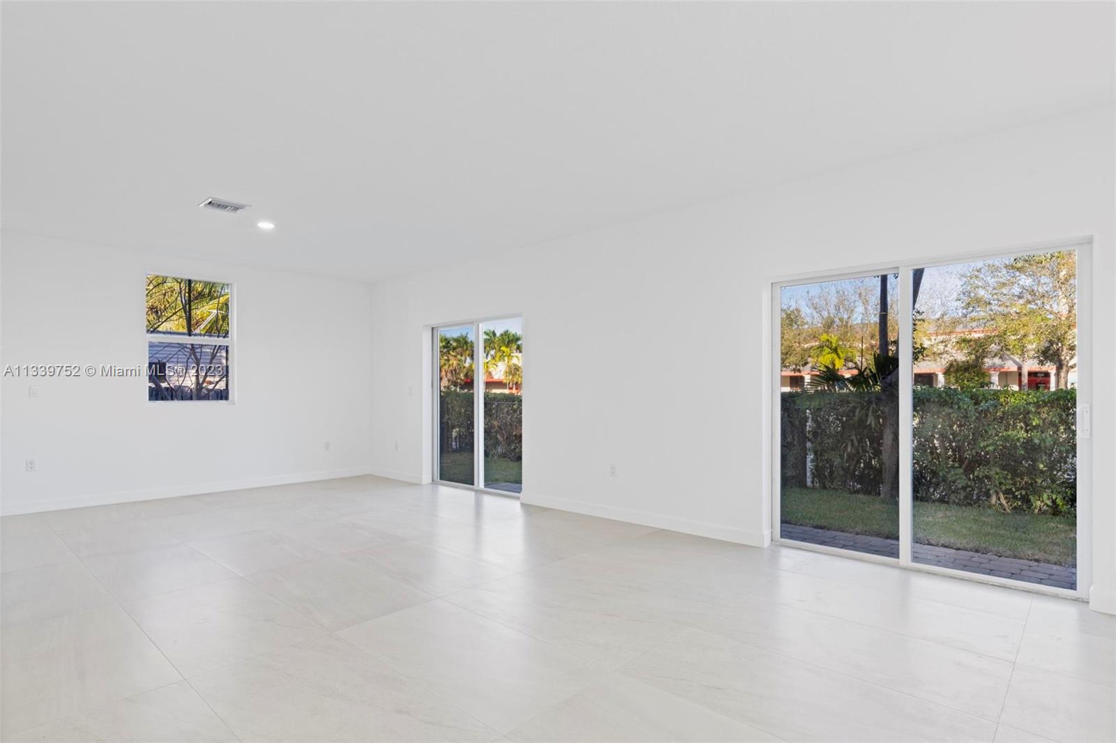 24721 Southwest 112th Court Homestead, FL 33032 - Photo 12 of 40 an empty room with window
