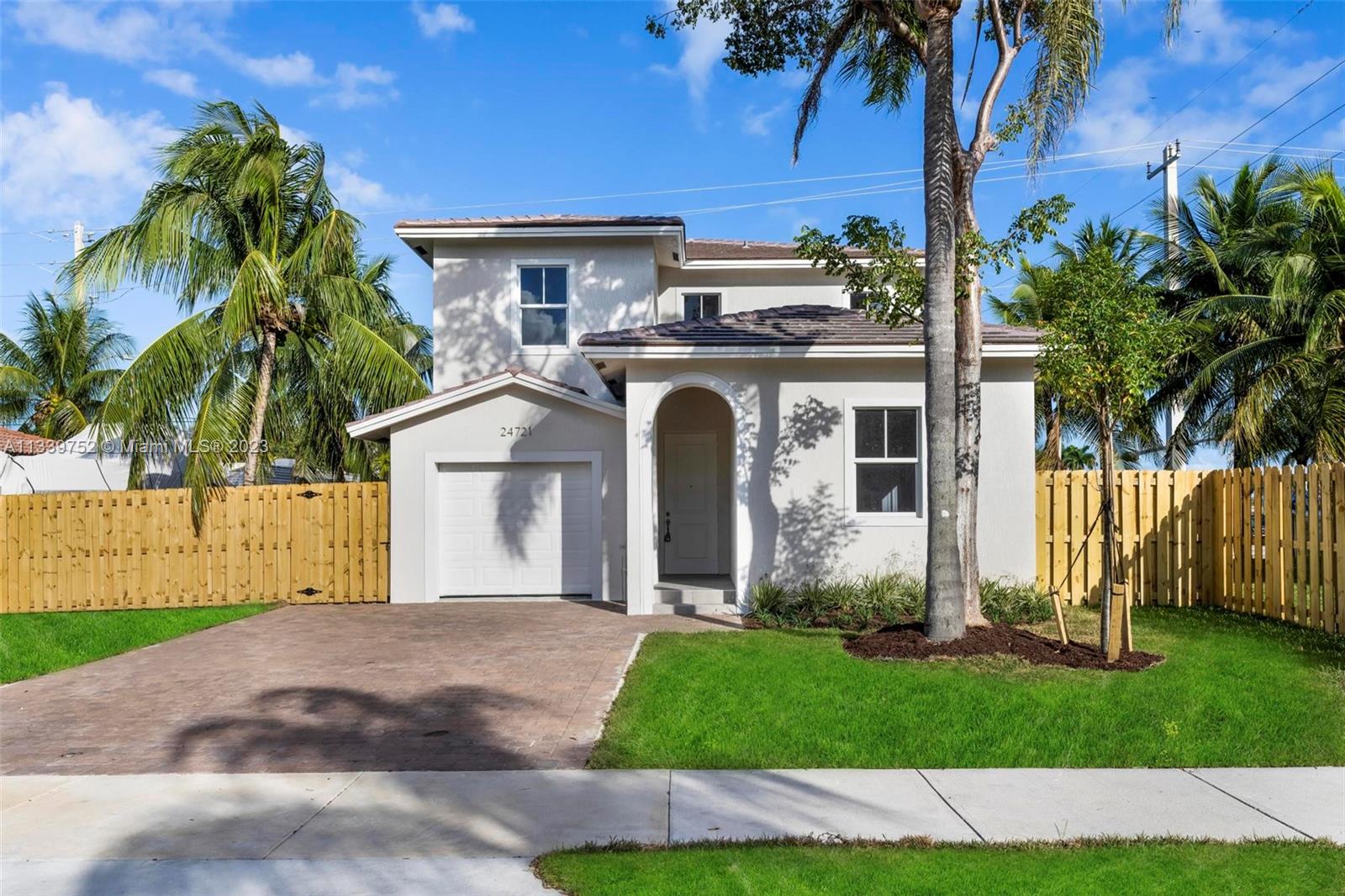 24721 Southwest 112th Court Homestead, FL 33032 - Photo 2 of 40 front view of a house with a garden