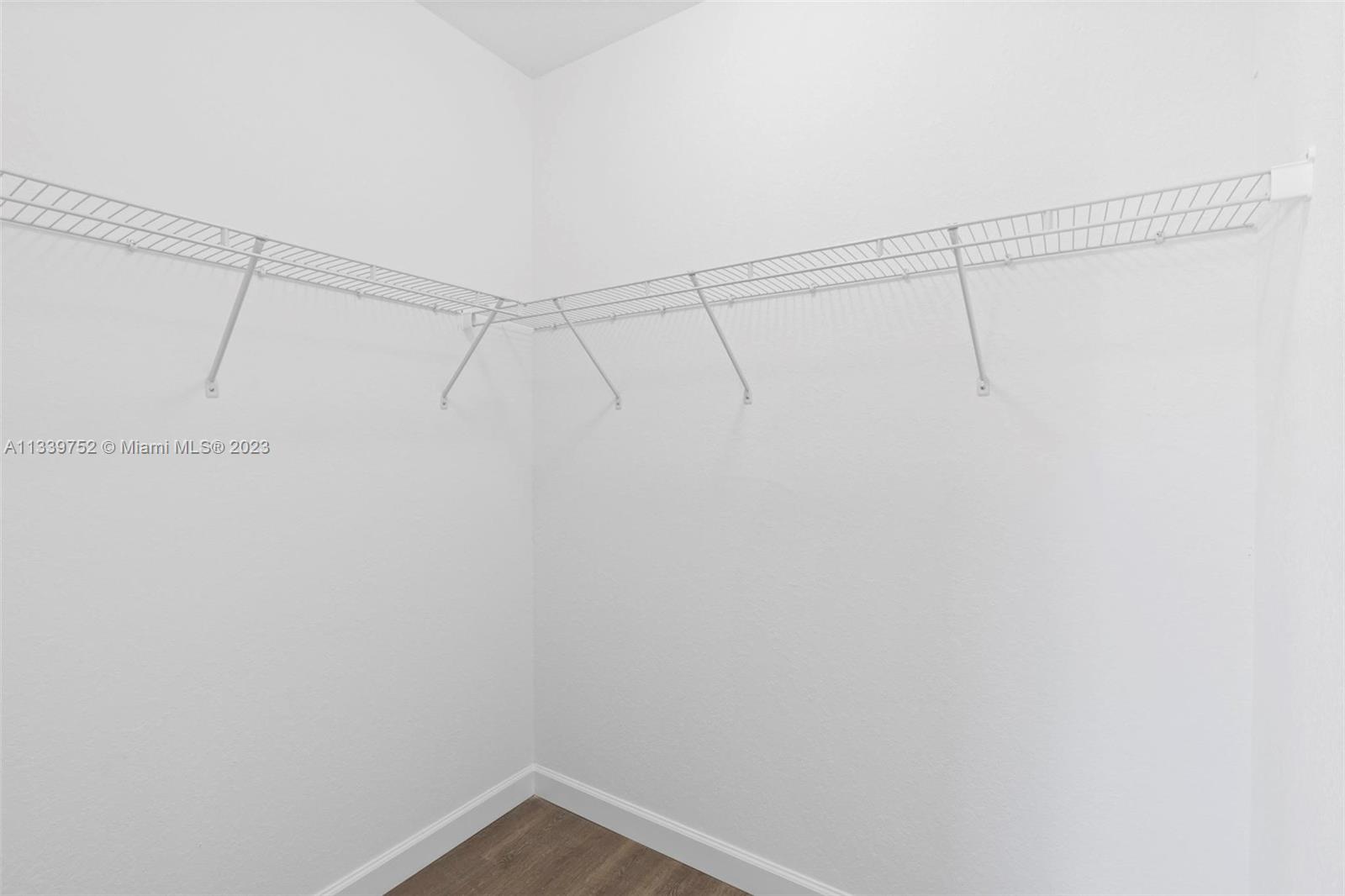 24721 Southwest 112th Court Homestead, FL 33032 - Photo 23 of 40 a view of a room with racks on the wall
