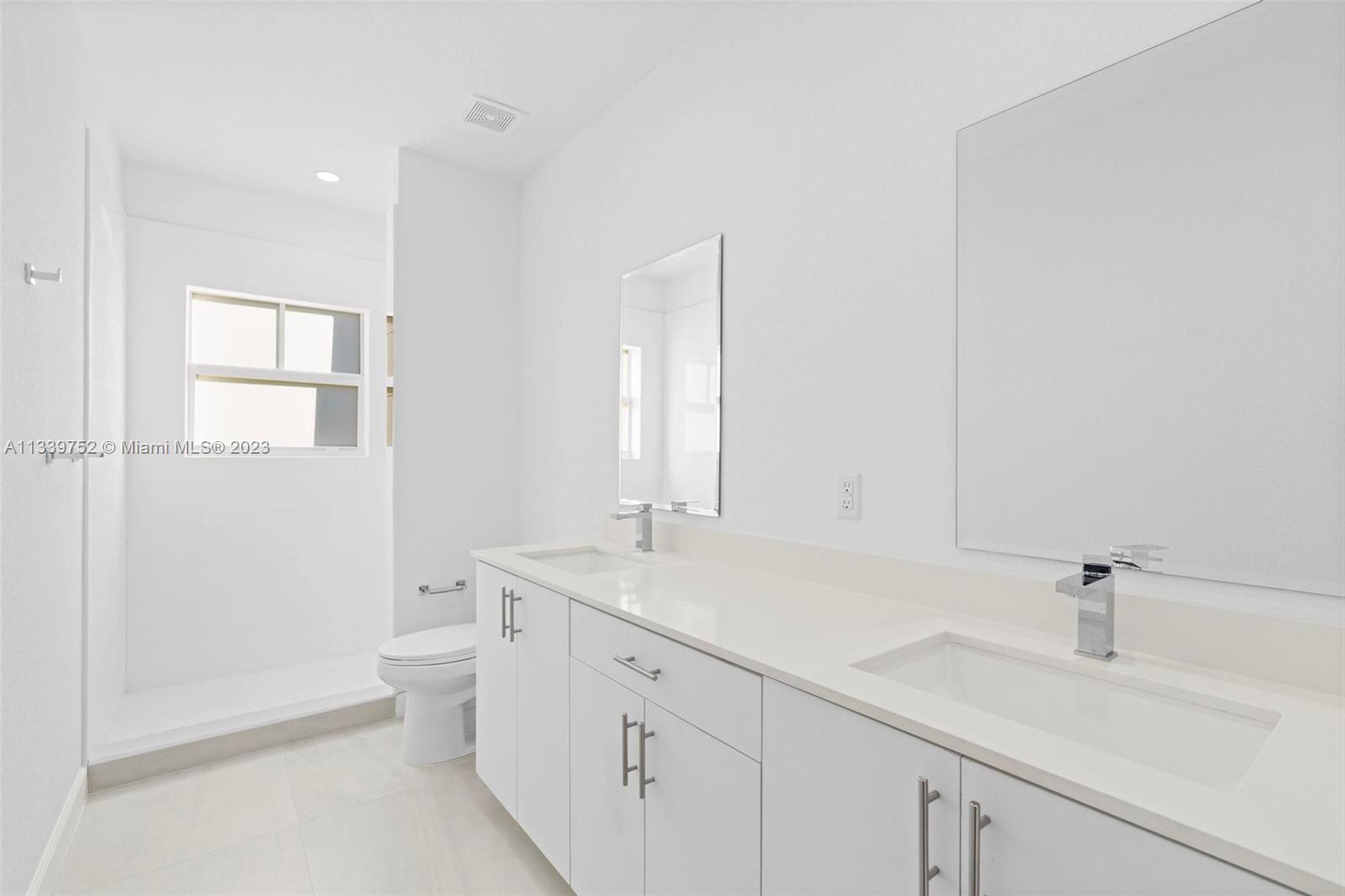 24721 Southwest 112th Court Homestead, FL 33032 - Photo 25 of 40 a bathroom with a sink a toilet and a shower