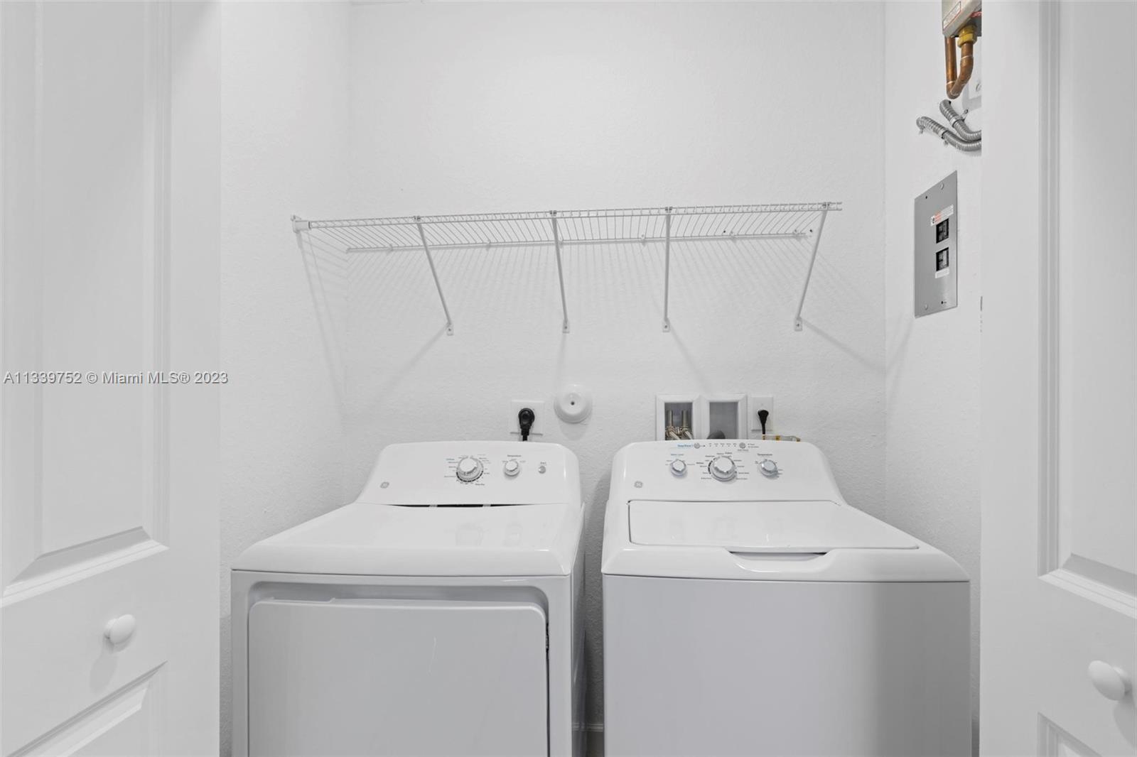 24721 Southwest 112th Court Homestead, FL 33032 - Photo 30 of 40 a utility room with dryer and washer
