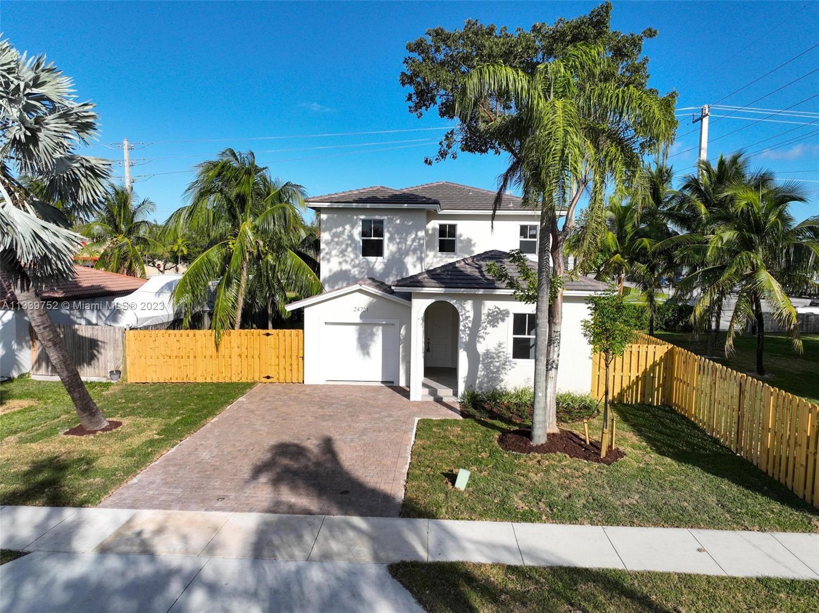 24721 Southwest 112th Court Homestead, FL 33032 - Photo 36 of 40 a front view of a house with garden