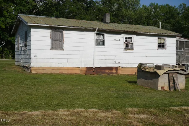 a backyard of a house with lots of green space