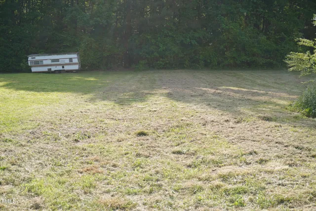 a view of a pool with a bench