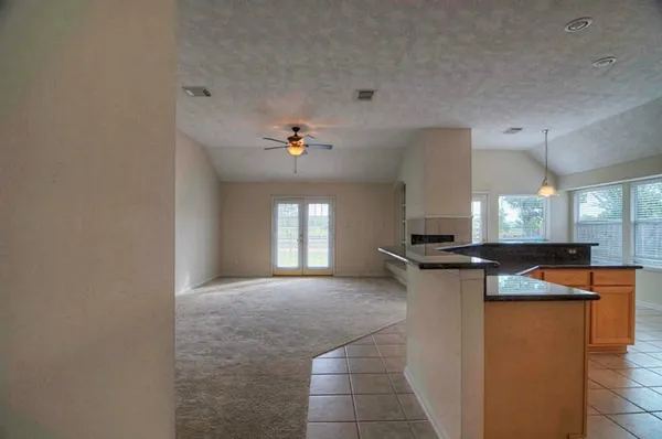 a kitchen with stainless steel appliances granite countertop a sink and a stove