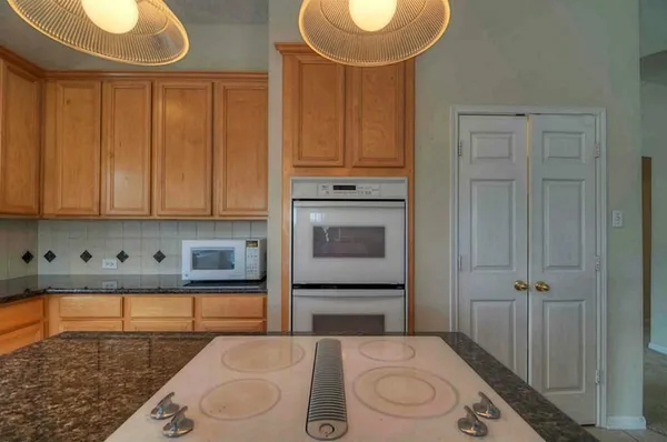 a bathroom with a sink a toilet and bathtub