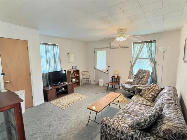a bedroom with furniture and a window