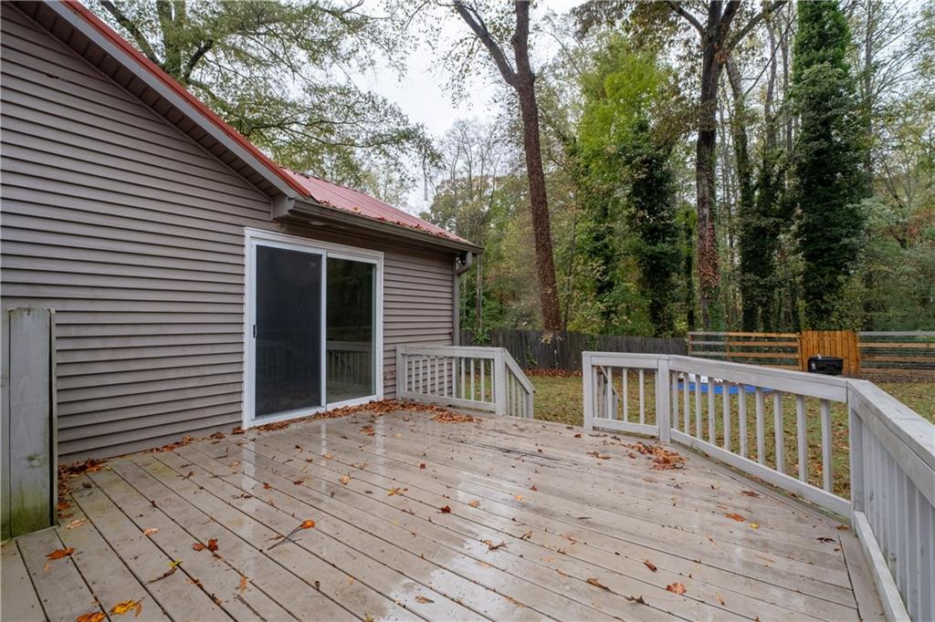5900 Jacobs Road Acworth, GA 30102 - Photo 15 of 18 a view of backyard with large trees and wooden fence