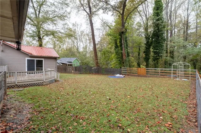 a backyard of a house with trampoline