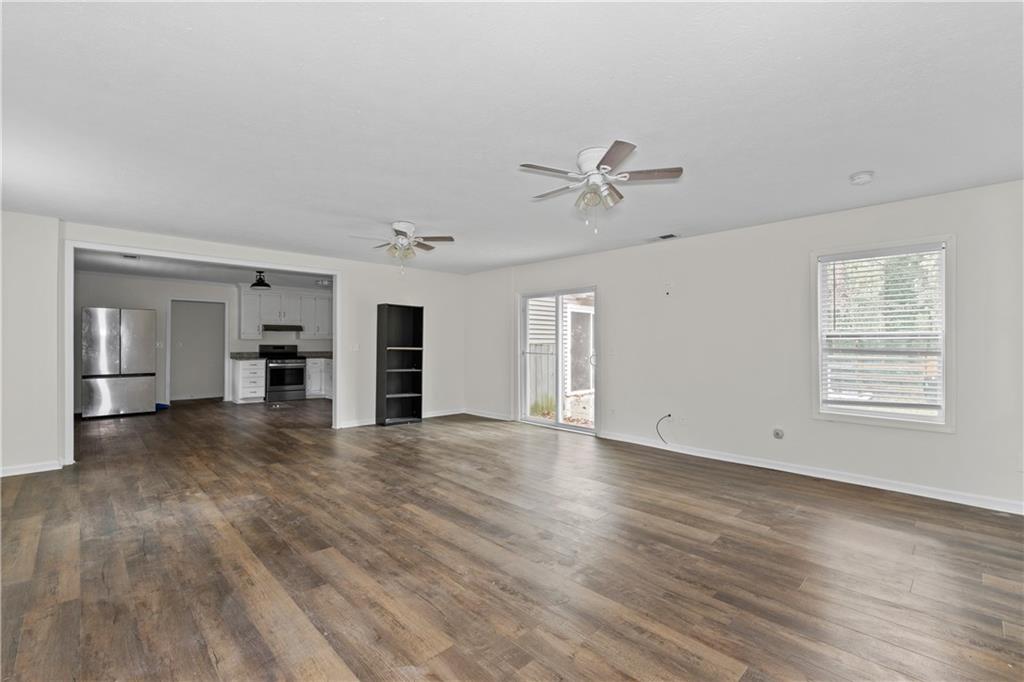 5900 Jacobs Road Acworth, GA 30102 - Photo 4 of 18 a view of empty room with wooden floor and ceiling fan