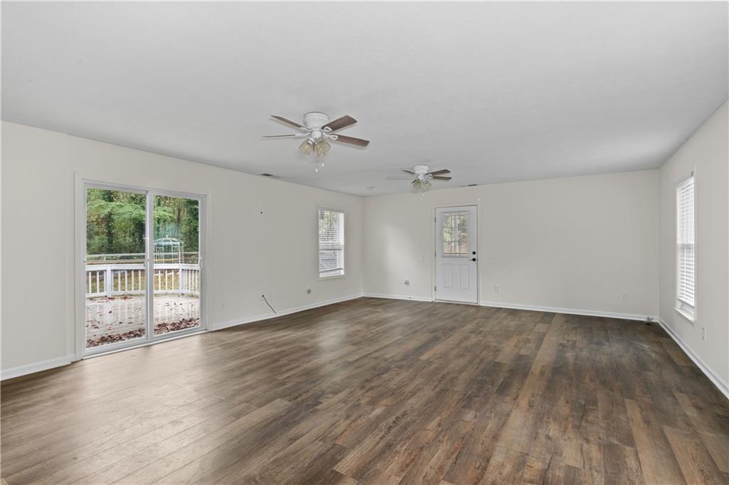 5900 Jacobs Road Acworth, GA 30102 - Photo 5 of 18 an empty room with wooden floor and windows