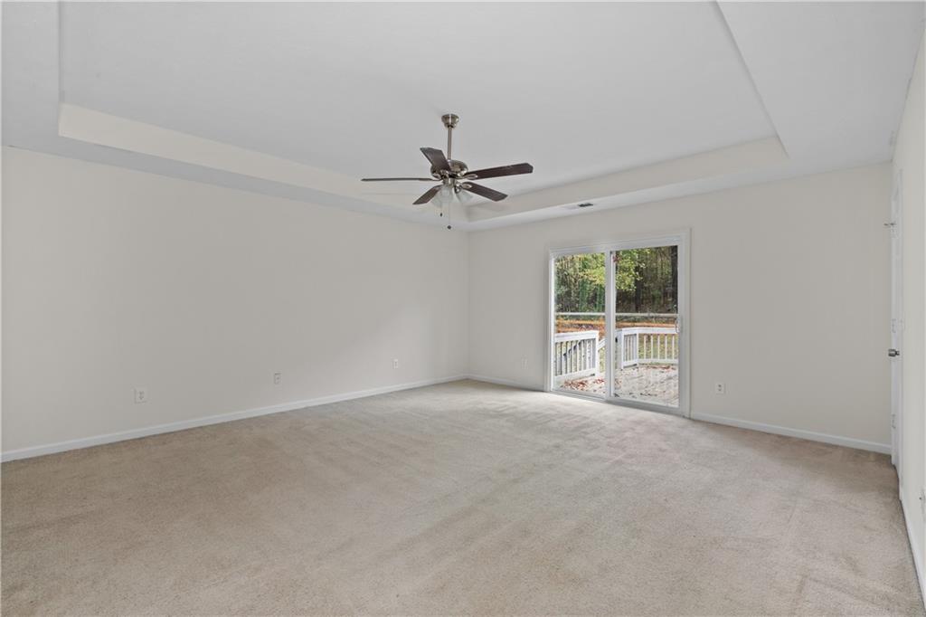 5900 Jacobs Road Acworth, GA 30102 - Photo 8 of 18 an empty room with a ceiling fan and window
