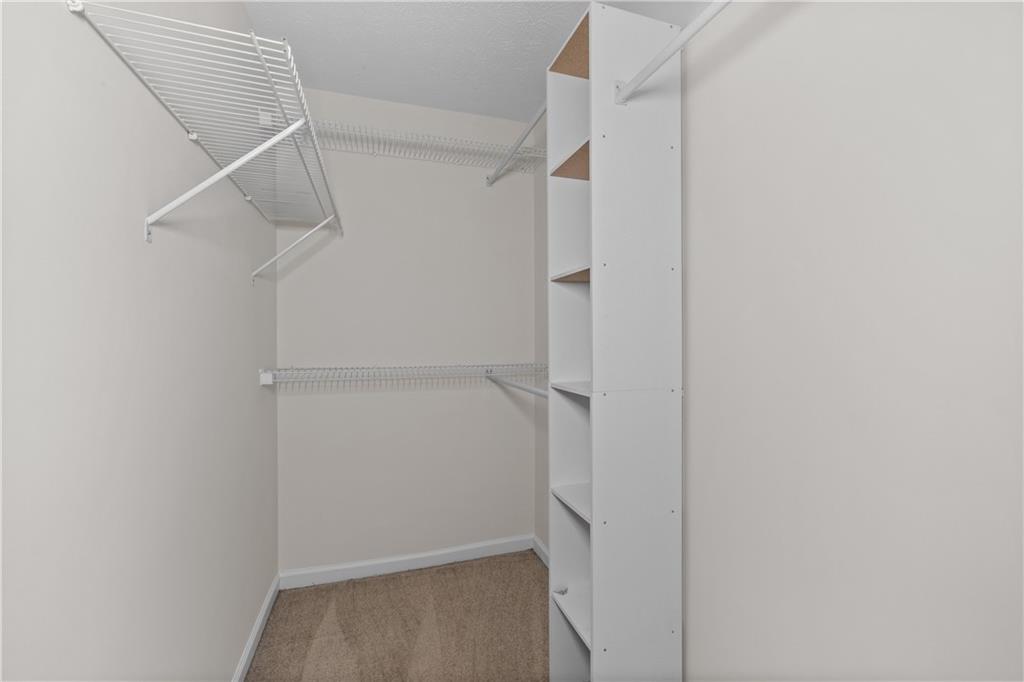5900 Jacobs Road Acworth, GA 30102 - Photo 10 of 18 a view of walk in closet with empty racks