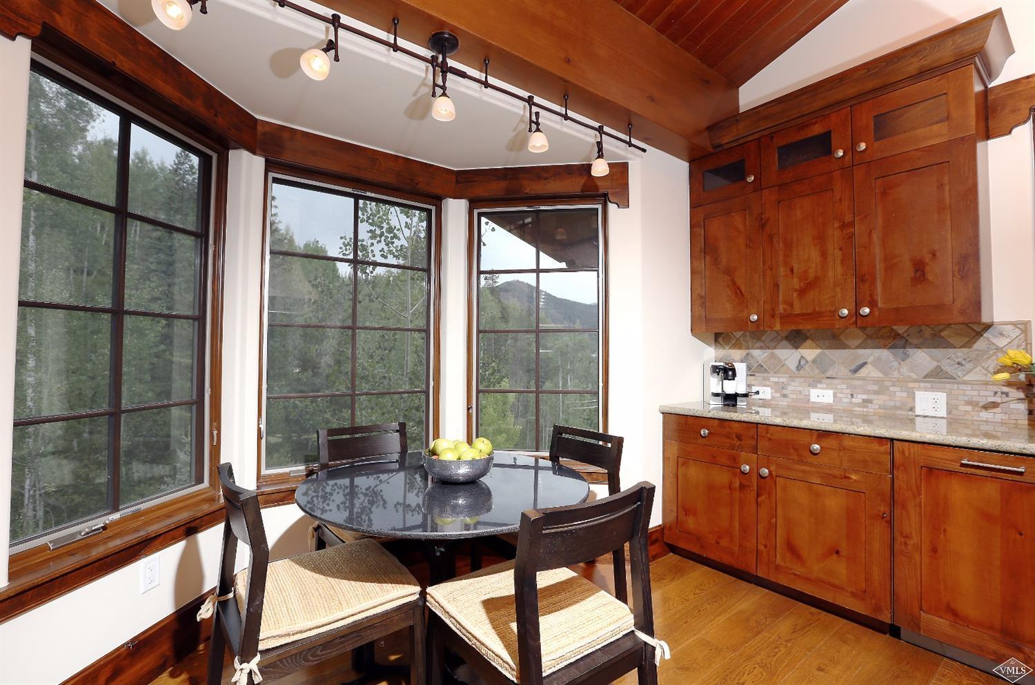 151 Vail Road, Unit 3 Vail, CO 81657 - Photo 11 of 25 a view of a dining room with furniture and window