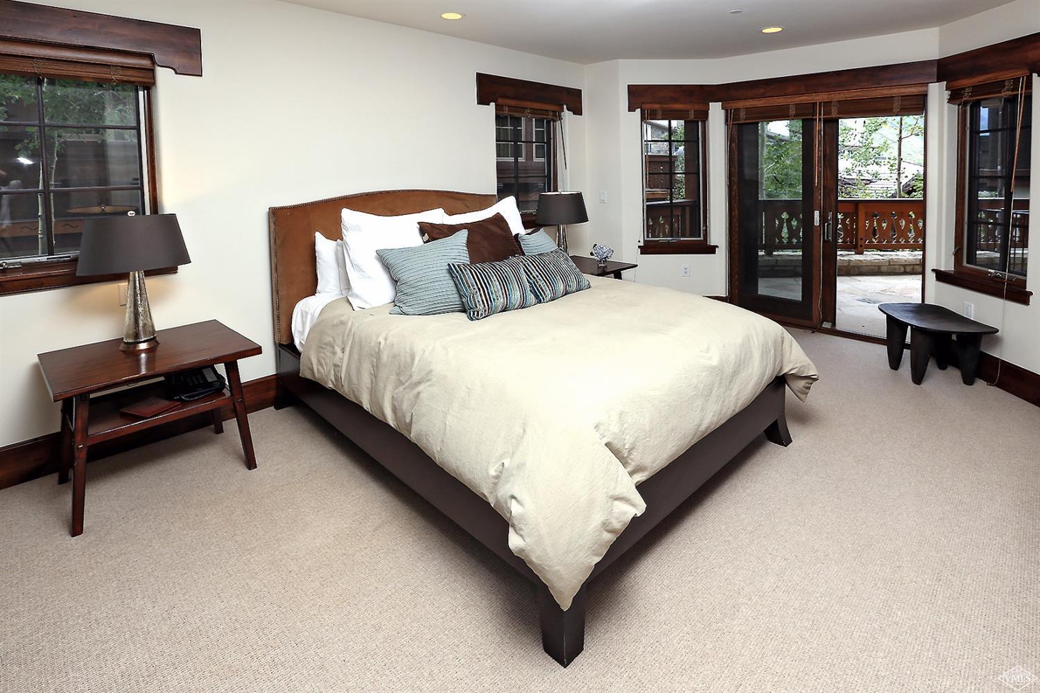 151 Vail Road, Unit 3 Vail, CO 81657 - Photo 18 of 25 a bed sitting in a bedroom next to a window