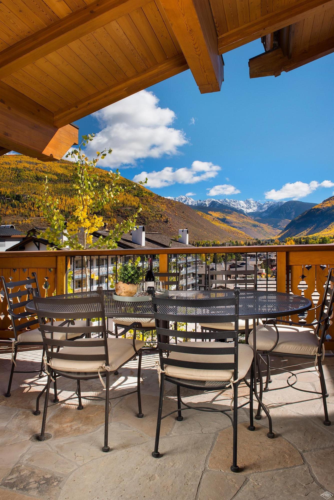 151 Vail Road, Unit 3 Vail, CO 81657 - Photo 22 of 25 a view of a chairs and table in the terrace