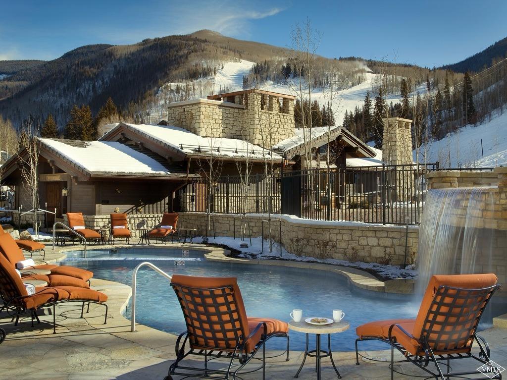 151 Vail Road, Unit 3 Vail, CO 81657 - Photo 25 of 25 a patio with a table and chairs