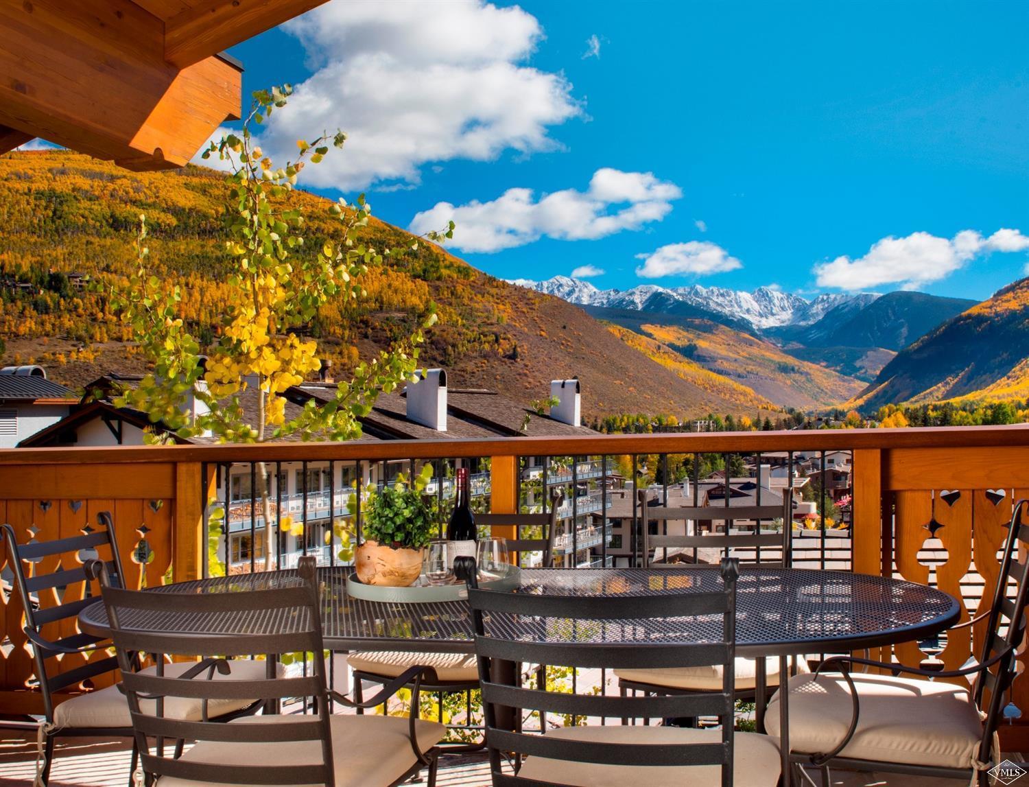 151 Vail Road, Unit 3 Vail, CO 81657 - Photo 3 of 25 a view of a chairs and table in patio