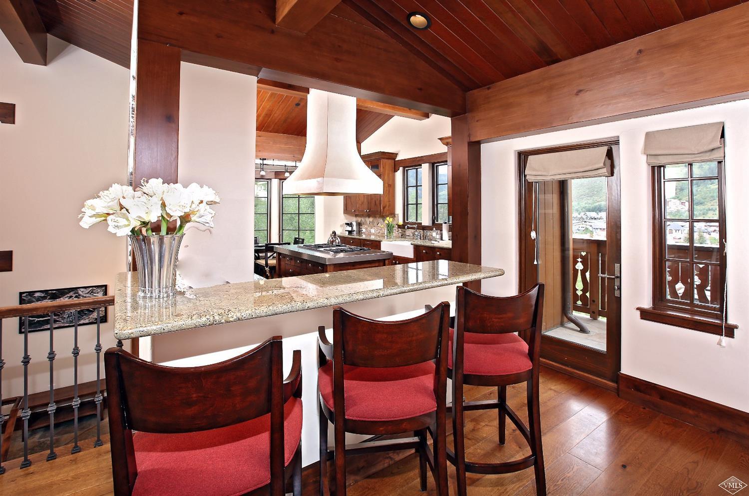 151 Vail Road, Unit 3 Vail, CO 81657 - Photo 7 of 25 a dining room with furniture and wooden floor