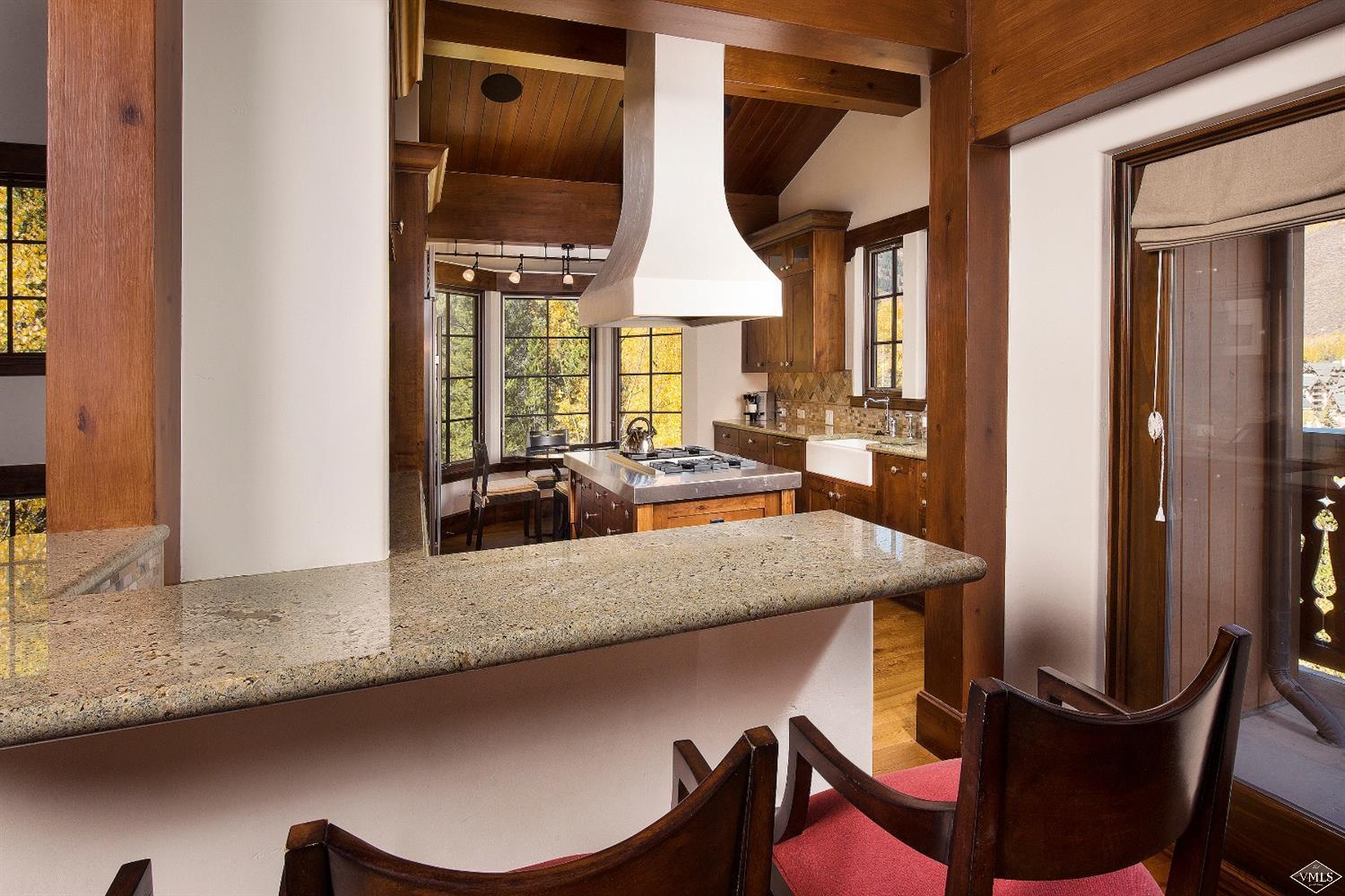 151 Vail Road, Unit 3 Vail, CO 81657 - Photo 8 of 25 a dining table with chairs and window