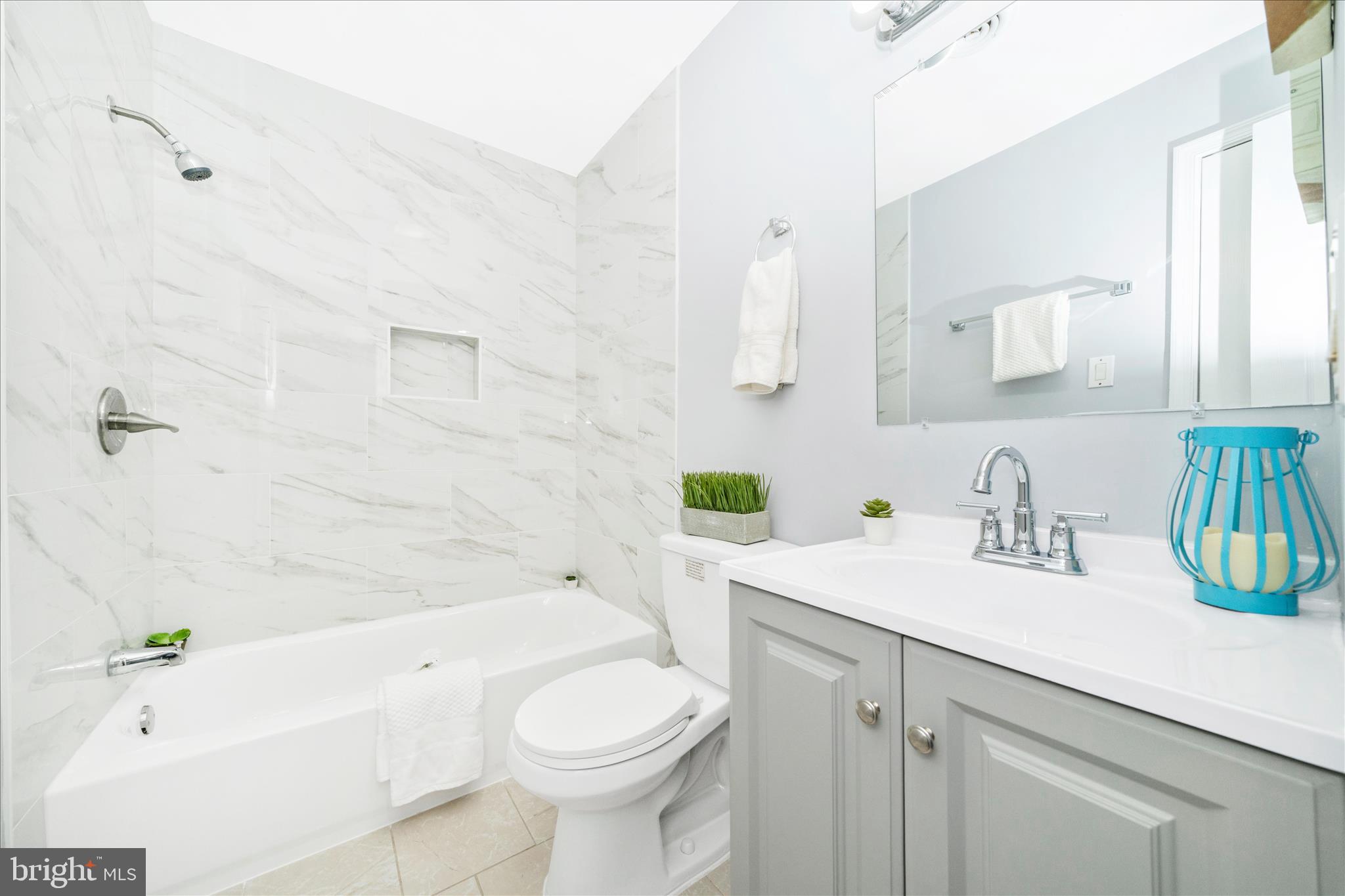 713 Seek Lane Silver Spring, MD 20912 - Photo 31 of 60 a bathroom with a sink a toilet and bathtub