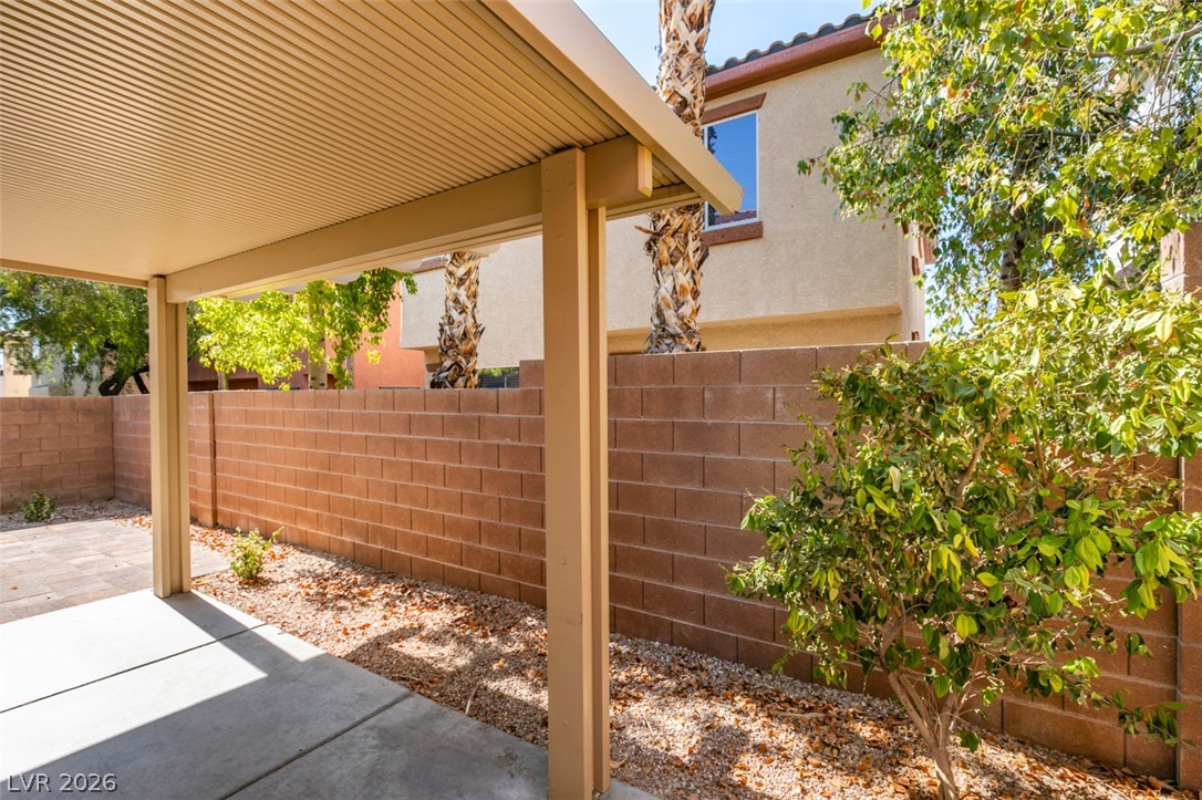 8937 Caledon Ridge Court Las Vegas, NV 89149 - Photo 38 of 43 A well-maintained covered patio offers a comfortable outdoor living space.