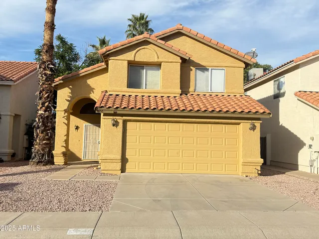 a front view of a house with a garage