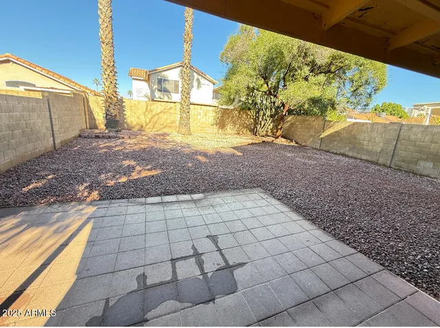a view of a backyard of the house