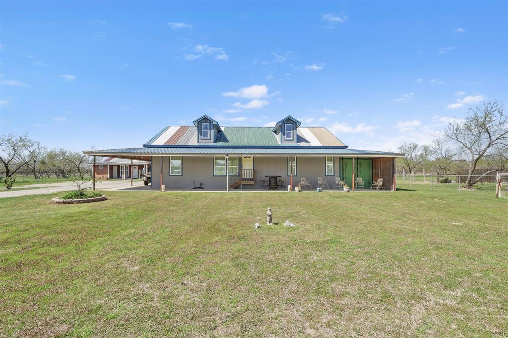 1556 John Wayne Road Kaufman, TX 75142 - Photo 1 of 33 a front view of a house with a garden and yard