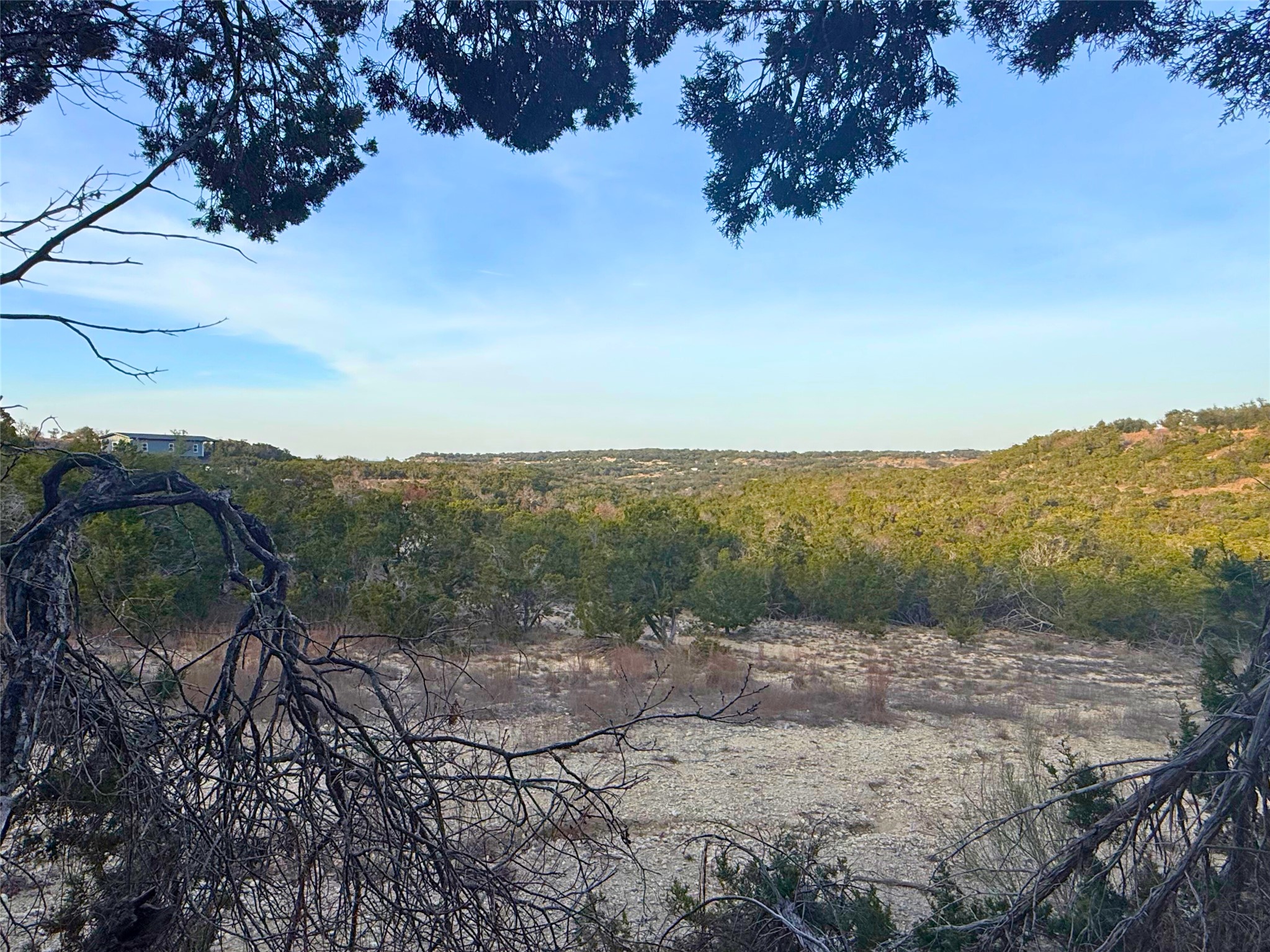 Lot 180 Lookout Mountain Road Johnson City, TX 78636 - Photo 20 of 29 a view of a lake with mountain in the background