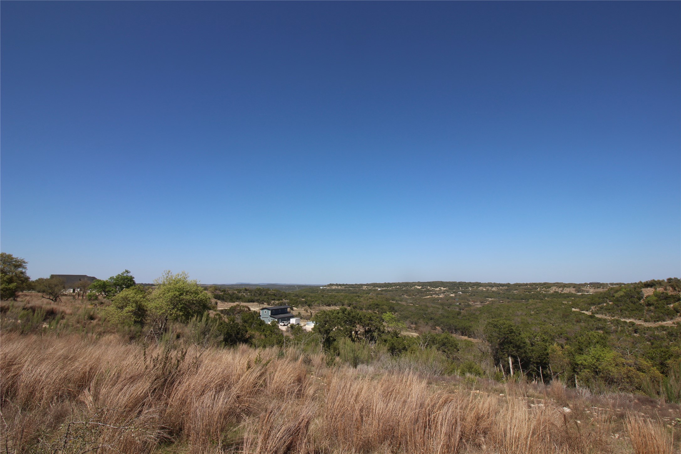 Lot 180 Lookout Mountain Road Johnson City, TX 78636 - Photo 27 of 29 a view of a lake and green valley