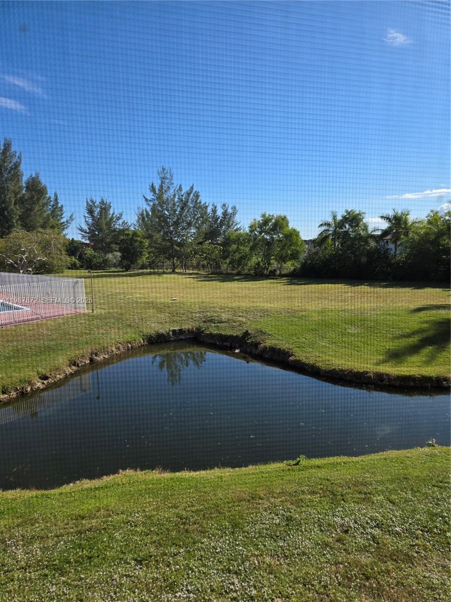 3400 Foxcroft Road, Unit 209 Miramar, FL 33025 - Photo 11 of 19 a view of a lake with houses in the background