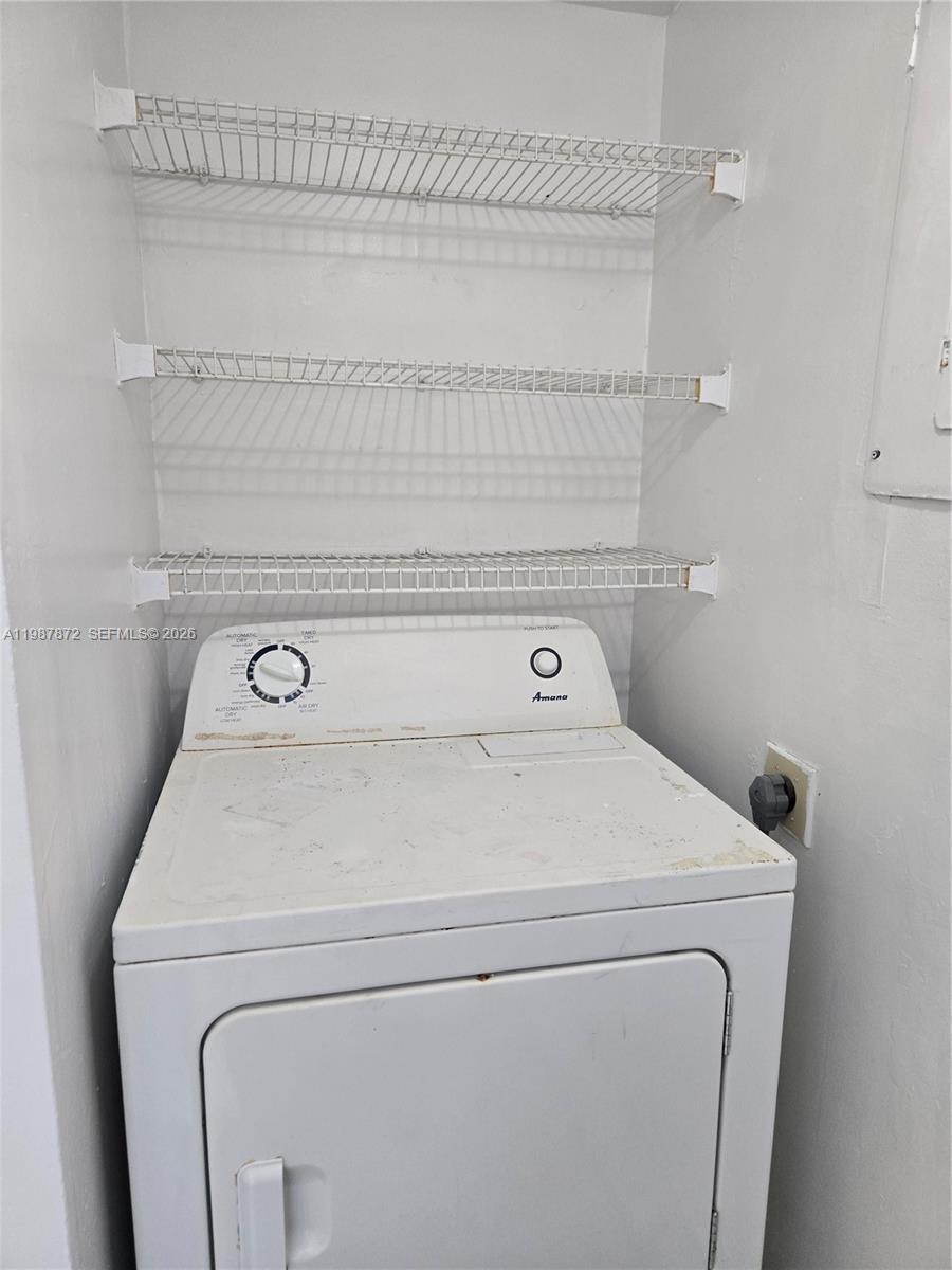 3400 Foxcroft Road, Unit 209 Miramar, FL 33025 - Photo 18 of 19 a utility room with dryer and washer