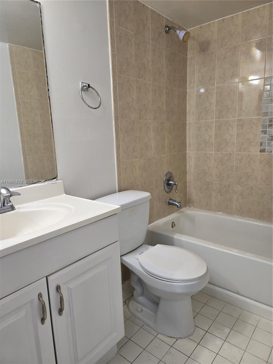 3400 Foxcroft Road, Unit 209 Miramar, FL 33025 - Photo 19 of 19 a bathroom with a sink a toilet and shower